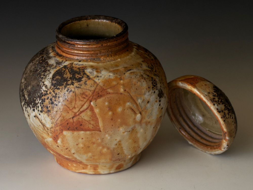 Harlow Award "Sycamore Oval Screw Top Jar" Stoneware with Shino slip. Bourry Box woodfired to Cone 11 and reduction cooled. Woodfired for three days. -Loren Scherbak
