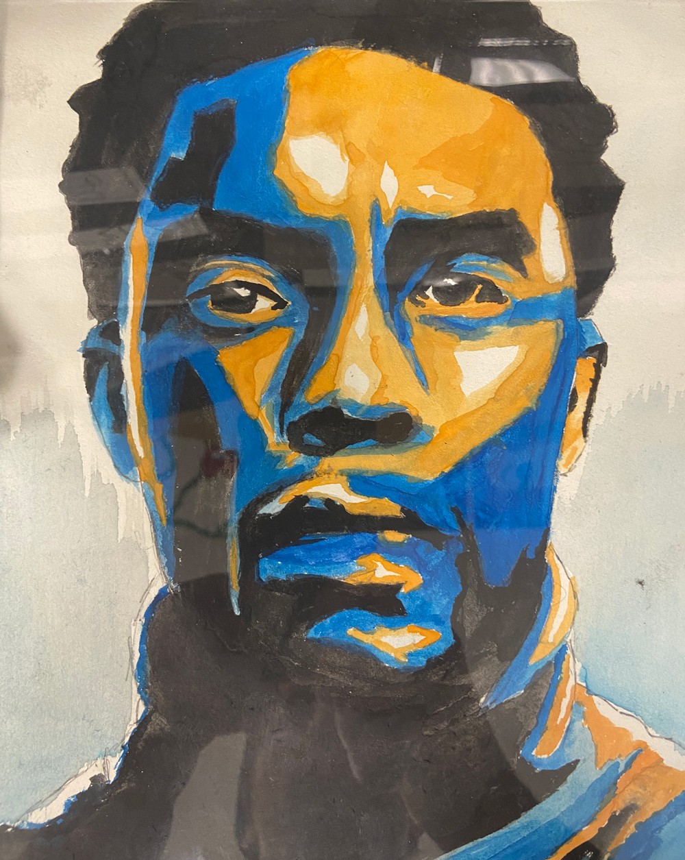 painting of a black man's face using blue and yellow color for high and low lights