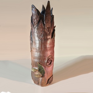 a vertical vessel with jagged edges at the top representing a broken tree trunk