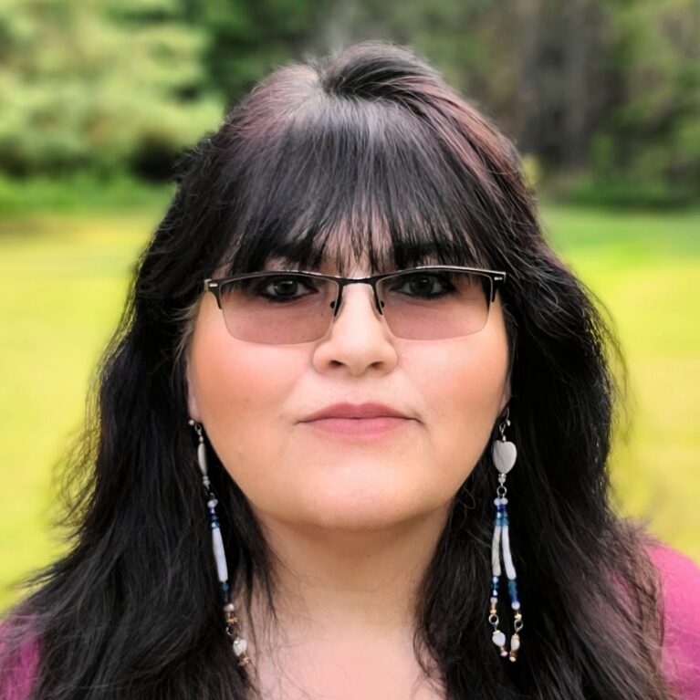 Portrait of dark hair woman outdoors