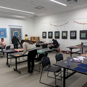 People working on art projects in an education classroom
